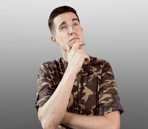 A man rubbing his chin and thinking