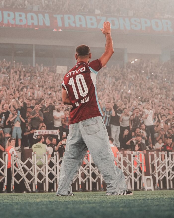 Mo salah stands in front of thousands of new fans at his unveiling in the Trabzonspor stadium