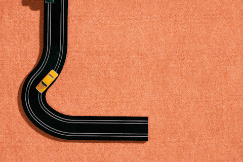 A GIF of cars on a Scalextric track